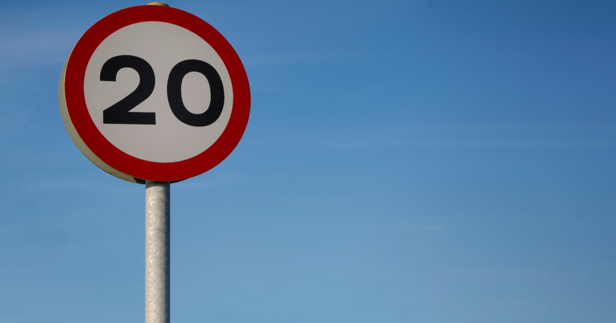 A 20mph sign aginst a blue sky